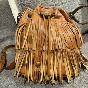 Tan leather Patricia Nash fringe purse.